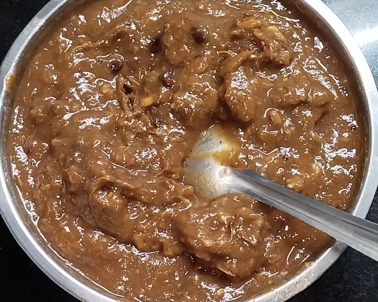 Fully softened tamarind after soaking in water, ready for making imli chutney