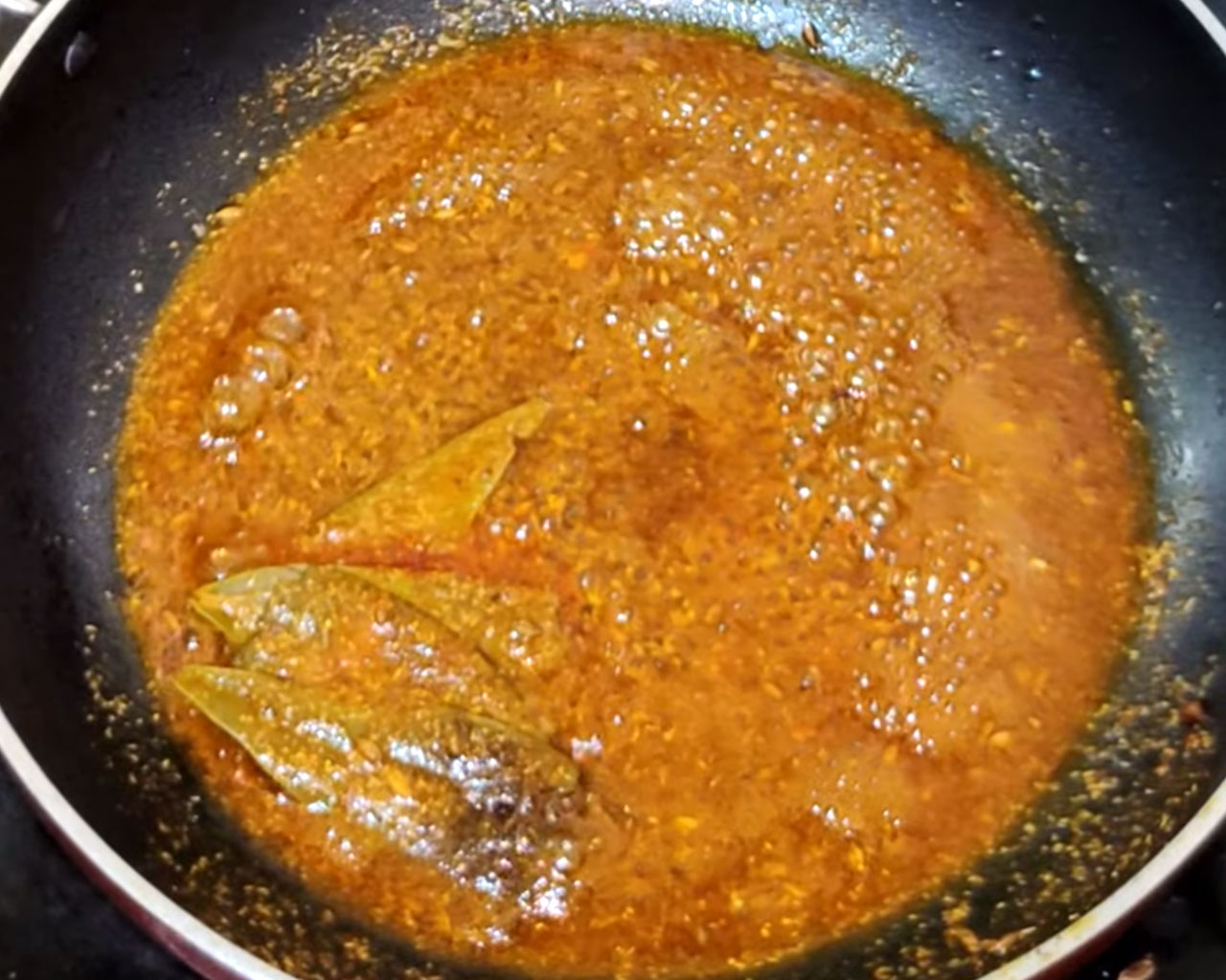 spices mixing in pan to make matar paneer masala