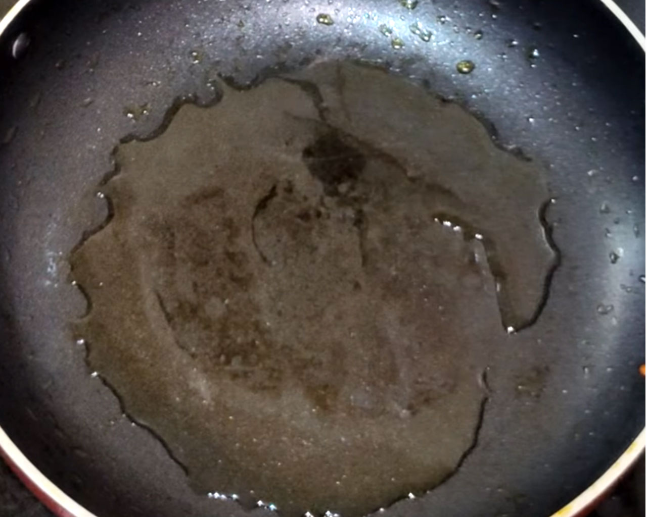 Heating oil in pan to make gravy for matar paneer