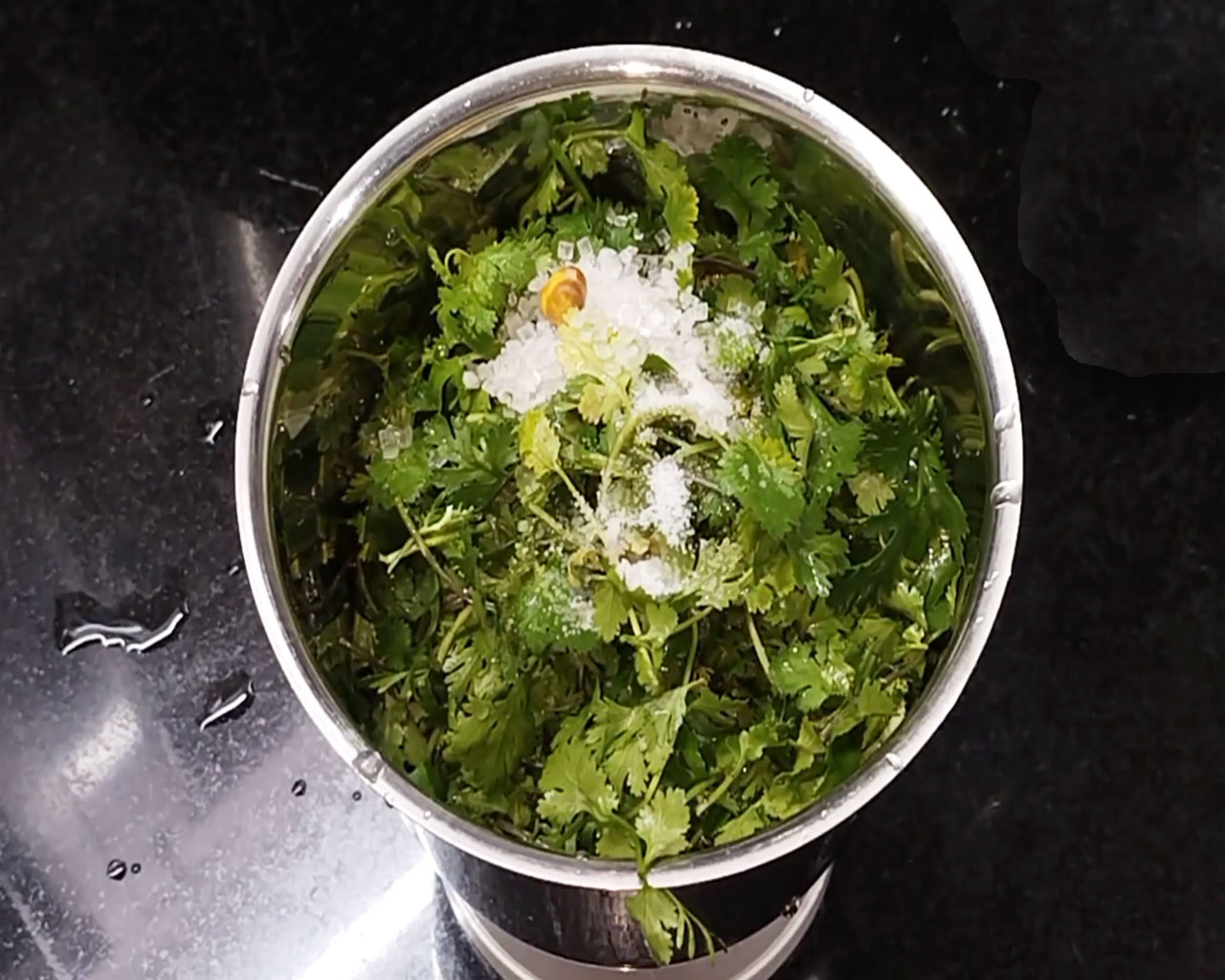 Adding sugar to coriander leaves