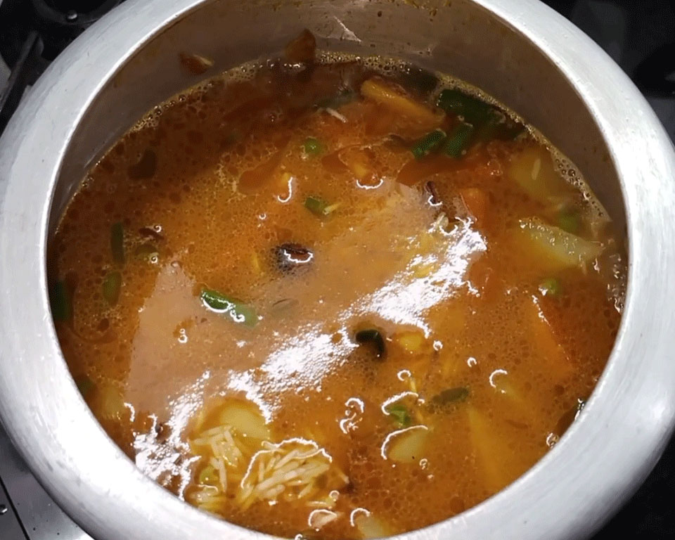 Pressure cooker sealed and cooking masala vegetable pulao for 3–4 whistles