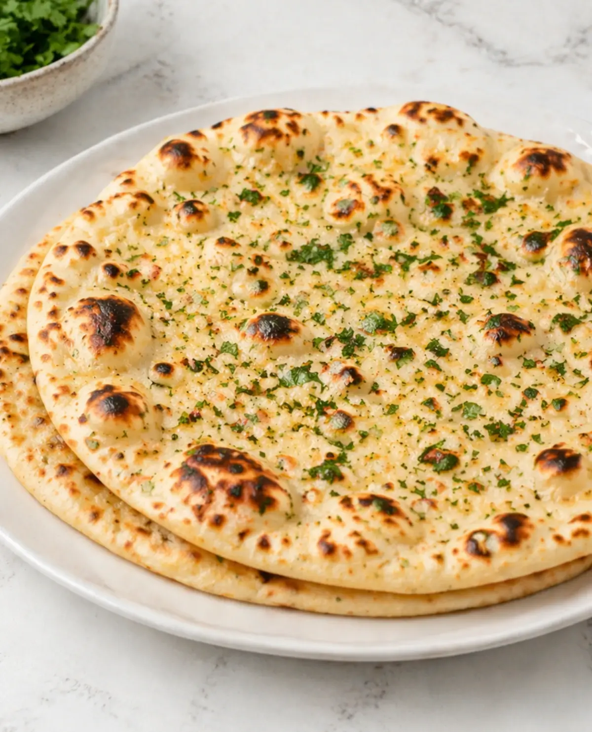 Garnic naan bread with button spread on top